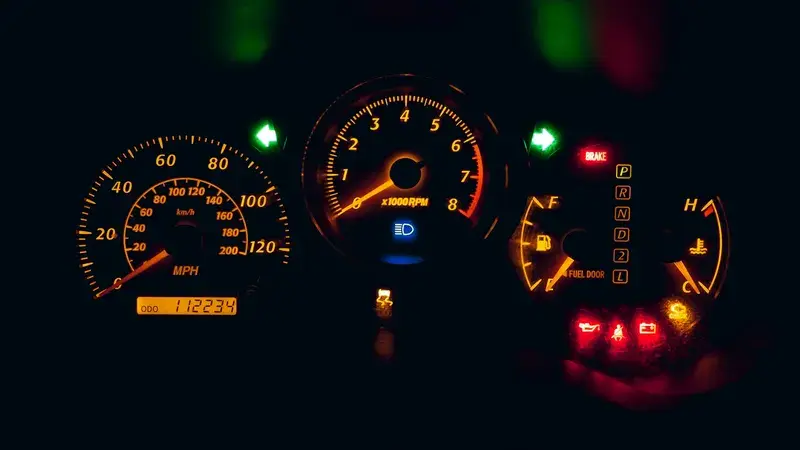 Black and yellow analog speedometer