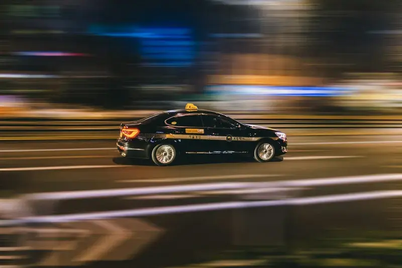 Timelapse photography of black vehicle at night